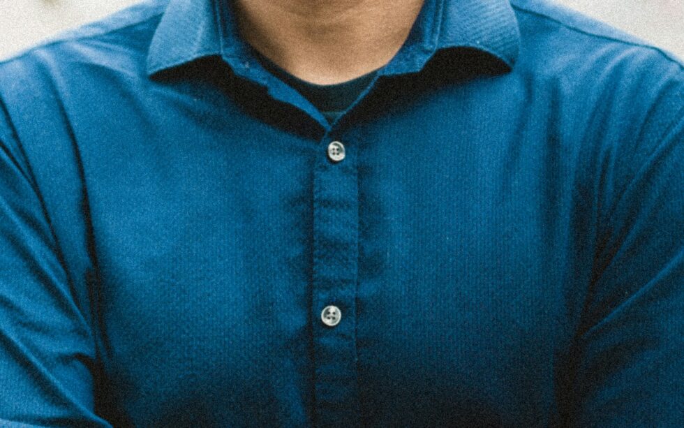 man in blue button up shirt